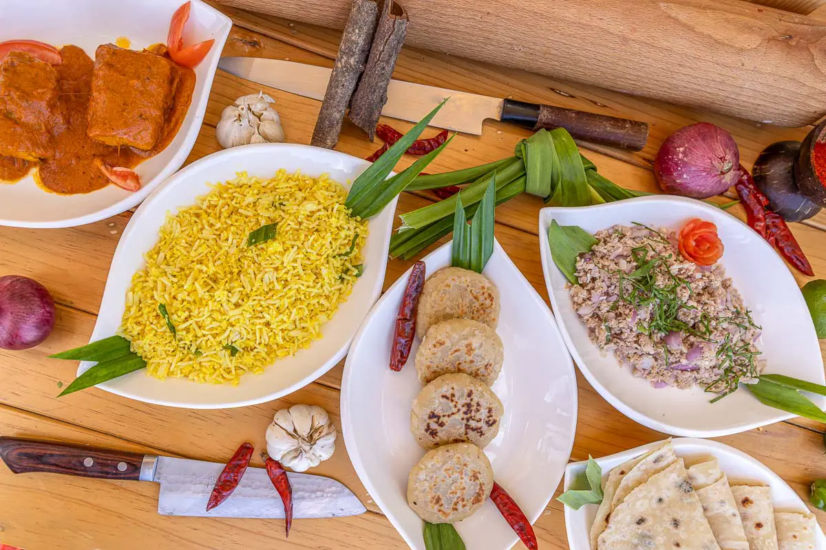 Famous Maldivian cuisine dishes on a wooden table