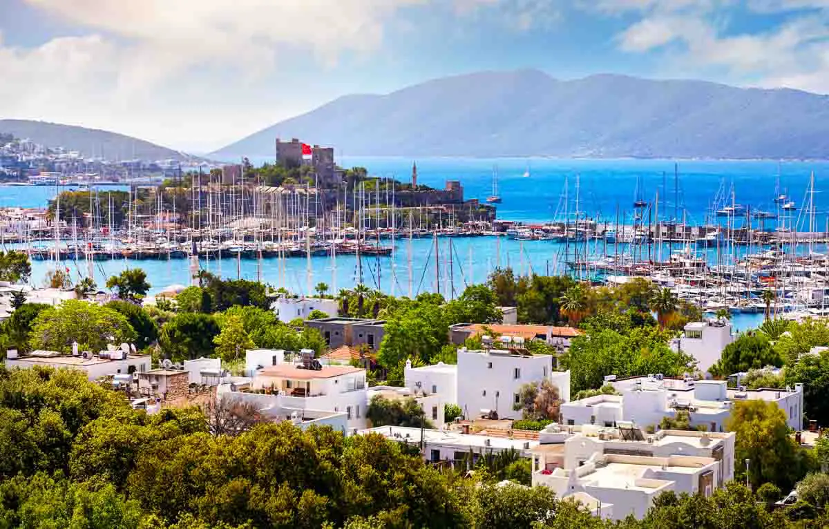 View of Bodrum Castle, a marina, and the harbor of the Aegean Sea in Bodrum, Turkey