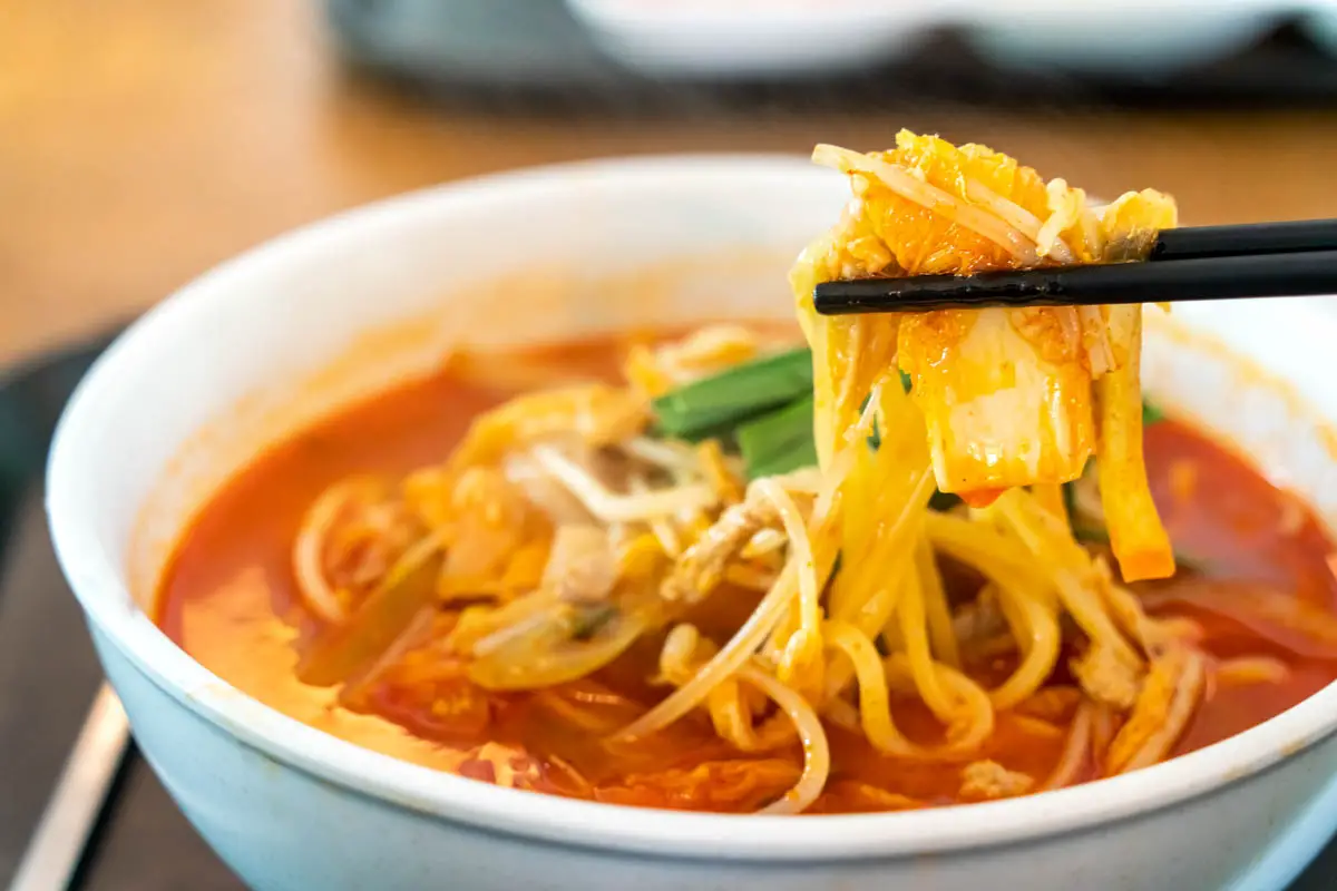 Delicious jjamppong, jjambbong, Chinese-style Korean noodle soup topped with red, spicy seafood and kimchi broth in South Korea.