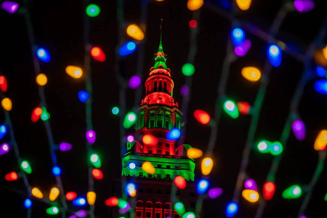 Terminal Tower seen through Christmas lights during the holiday season in downtown Cleveland, Ohio, USA