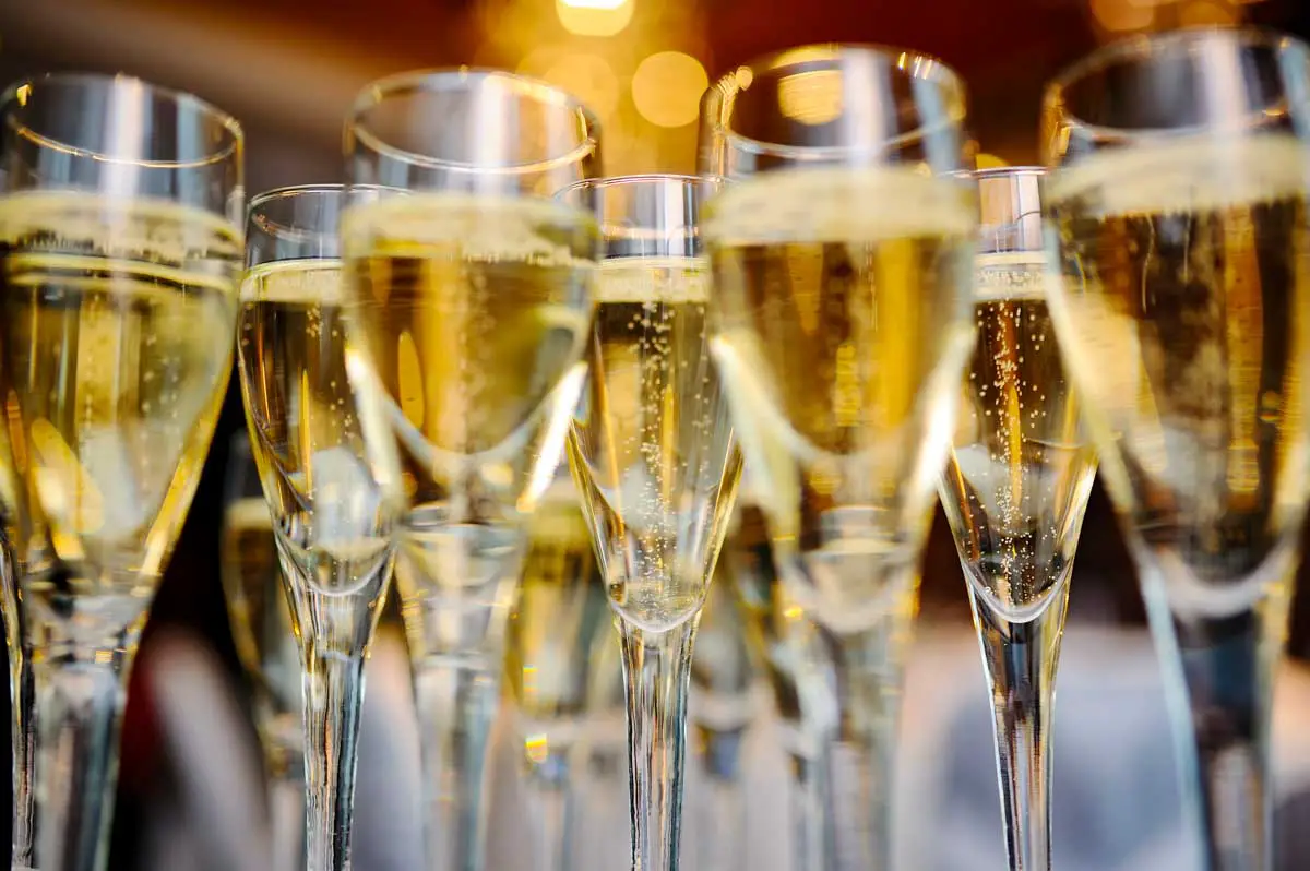 champagne glasses on a background of lights