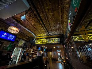 Cead Mile Failte in stained glass welcomes customers as they enter the main bar area of The Old Shillelagh in Detroit, Michigan, USA