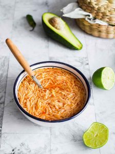 Sopa de fideo, a traditional Mexican soup with toasted fideos (similar to vermicelli) and a tomato broth