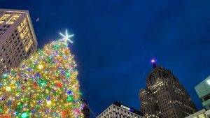 Detroit Christmas tree at Campus Martius Park with the downtown Detroit skyline at night
