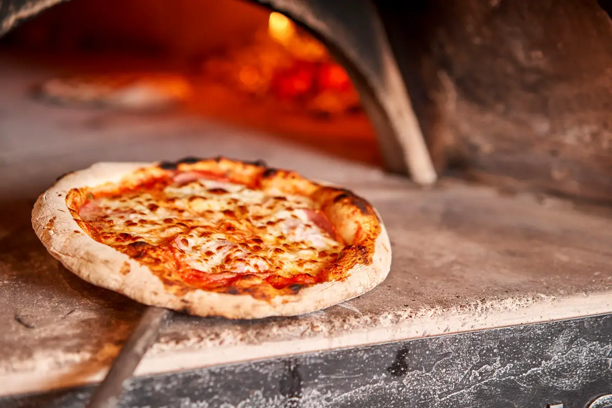 Neapolitan pizza fresh out of the oven in Naples, Italy