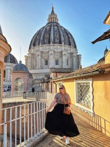 Female traveler wears a long, modest skirt at St. Peter's Basilica, Vatican City