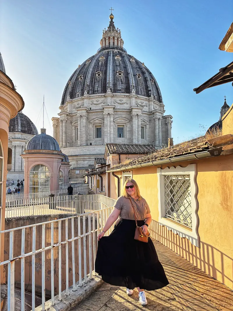Female traveler wears a long, modest skirt at St. Peter's Basilica, Vatican City